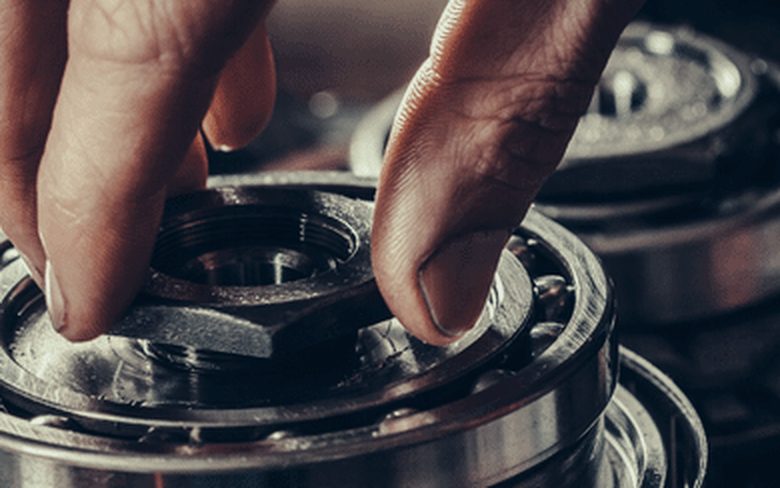 ASB mechanic with a disassembled automatic transmission